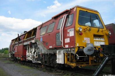 image showing a large yellow on-track machine