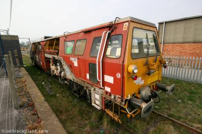 image showing a large yellow on-track machine