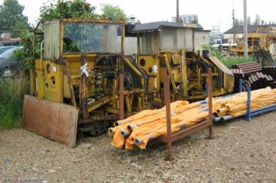 image showing a large yellow on-track machine