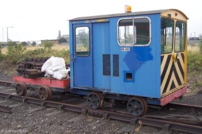 image showing a large yellow on-track machine