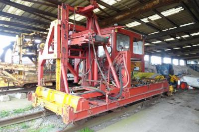 image showing a large yellow on-track machine