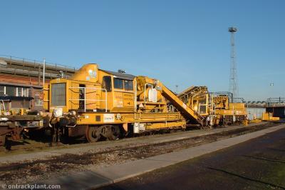 image showing a large yellow on-track machine
