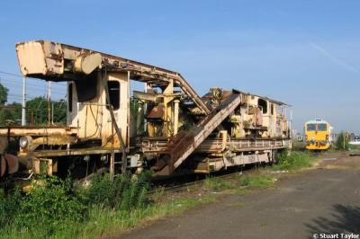image showing a large yellow on-track machine