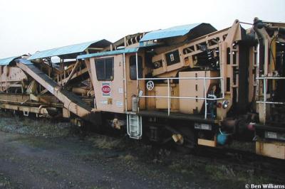 image showing a large yellow on-track machine
