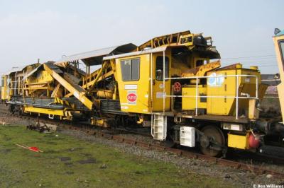 image showing a large yellow on-track machine