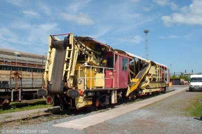 image showing a large yellow on-track machine