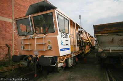 image showing a large yellow on-track machine