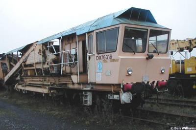 image showing a large yellow on-track machine