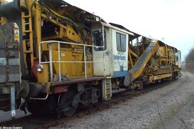 image showing a large yellow on-track machine