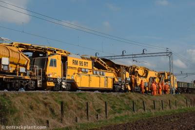 image showing a large yellow on-track machine