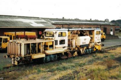 image showing a large yellow on-track machine