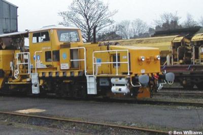 image showing a large yellow on-track machine