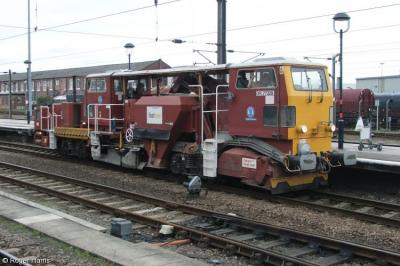 image showing a large yellow on-track machine