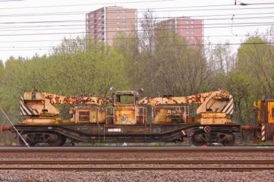 image showing a large yellow on-track machine