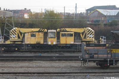 image showing a large yellow on-track machine