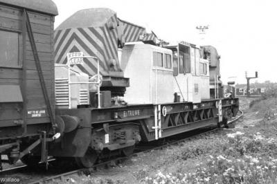 image showing a large yellow on-track machine