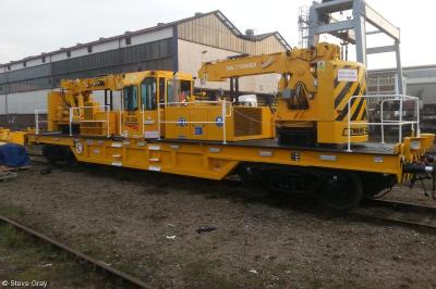 image showing a large yellow on-track machine
