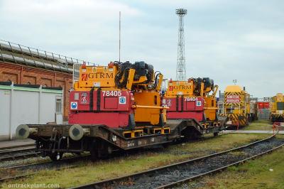 image showing a large yellow on-track machine