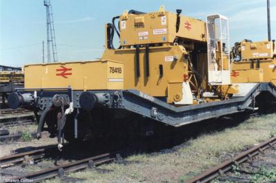 image showing a large yellow on-track machine
