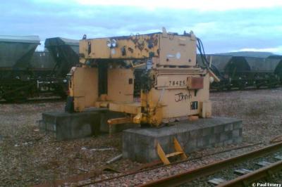 image showing a large yellow on-track machine