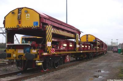 image showing a large yellow on-track machine