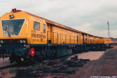 image showing a large yellow on-track machine