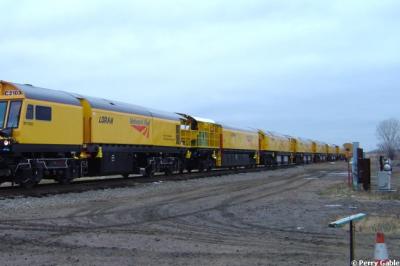 image showing a large yellow on-track machine