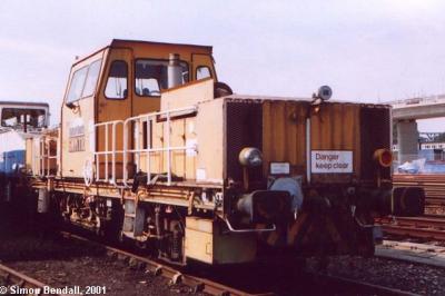 image showing a large yellow on-track machine