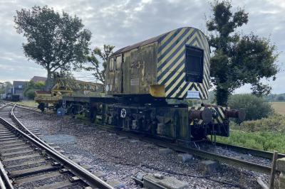 image showing a large yellow on-track machine