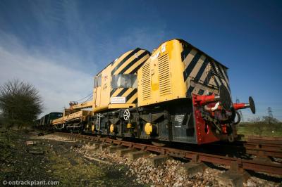image showing a large yellow on-track machine