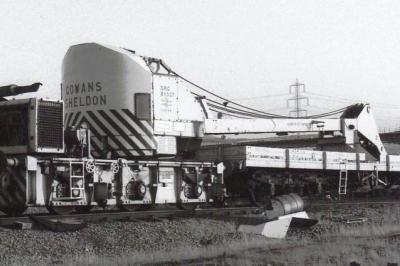image showing a large yellow on-track machine