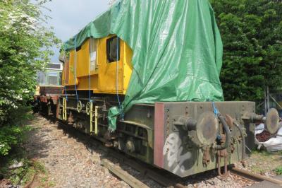 image showing a large yellow on-track machine
