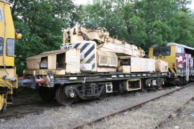 image showing a large yellow on-track machine