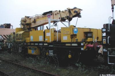 image showing a large yellow on-track machine
