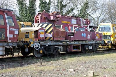 image showing a large yellow on-track machine