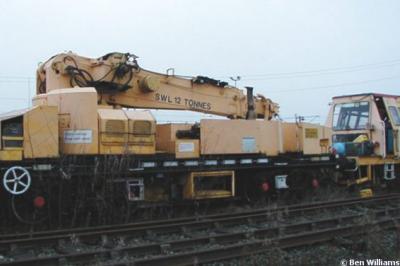 image showing a large yellow on-track machine
