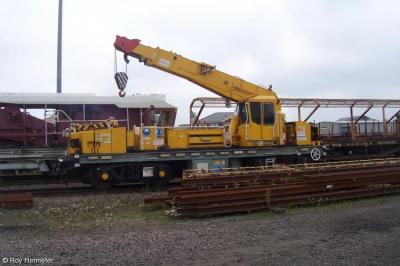 image showing a large yellow on-track machine