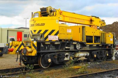 image showing a large yellow on-track machine