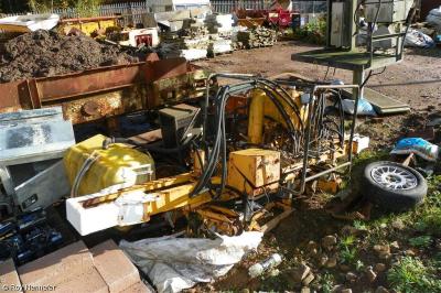 image showing a large yellow on-track machine