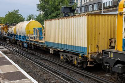 image showing a large yellow on-track machine