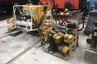 image showing a large yellow on-track machine