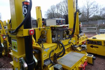 image showing a large yellow on-track machine
