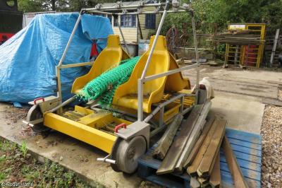 image showing a large yellow on-track machine