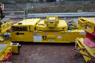 image showing a large yellow on-track machine