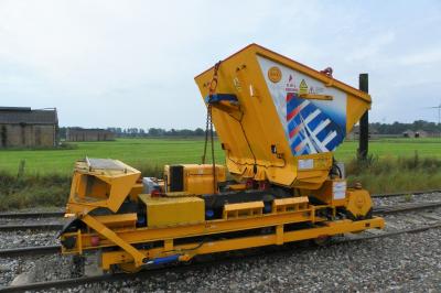 image showing a large yellow on-track machine