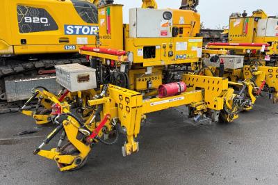 image showing a large yellow on-track machine