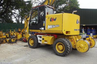 image showing a large yellow on-track machine