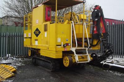 image showing a large yellow on-track machine