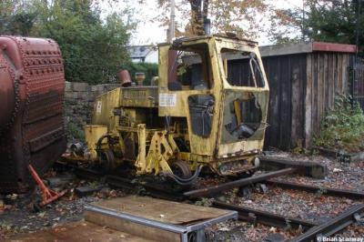 image showing a large yellow on-track machine