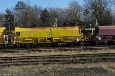 image showing a large yellow on-track machine